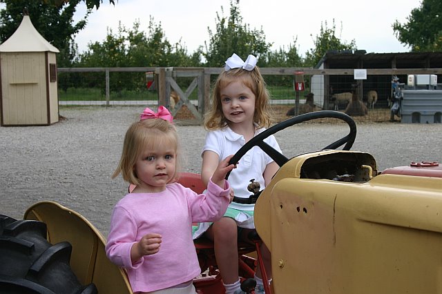 2006_09_27 Jane and Cate on tractor Apple picking.jpg
